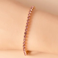 Detail of pink zircon tennis bracelet with gold-plated metal base worn on wrist - 16.5+5CM / Purple