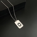 Silver titanium steel necklace with rectangular brushed metal pendant and C cut-out - Letter O