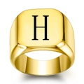 Detail of a square gold signet ring featuring a black letter H on polished steel surface - Size 6 / Style H