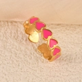 Elegant gold open ring featuring a row of vibrant pink enamel hearts on a warm textured base - Full Circle Heart Pink Gold Style (k-13)