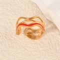 Adjustable wavy gold-plated ring featuring vibrant red enamel inlay and hollow design - Wave Pattern Red Gold Style (k-17)
