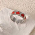 Adjustable silver stainless steel wide ring featuring five vibrant red enamel hearts - Full Circle Heart Red Style (k-43)