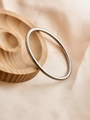 Polished silver 6mm minimalist bangle displayed on elegant silk and wooden tray - Polished Style / Silver