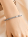 Detailed macro view of 6mm frosted matte texture on minimalist silver bangle on wrist - Frosted Style / Silver