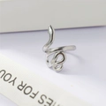 Minimalist silver snake wrap adjustable ring with polished finish on ribbon background - Snake Style (123 Steel Color)