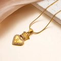 Golden crown heart necklace with letter R pendant on a luxury marble and silk backdrop - Letter R