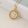Gold stainless steel necklace with round crystal-set pendant featuring script letter J - Letter J