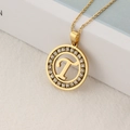 Gold stainless steel necklace with round rhinestone paved pendant featuring letter T - Letter T