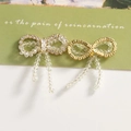 Detailed view of elegant bow jewelry with crystal bead tassels and sparkling rhinestones - Gold And Silver Rhinestone Style (2)