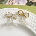 Detail of sweet crystal bowknot earrings with white beads and elegant tassel charms - Transparent Crystal Tassel Style (3)