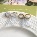 Detail of light blue beaded bow accessory with rhinestones and elegant tassel fringe - Light Blue Beaded Style (5)