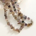 Close-up of translucent natural fluorite stone chips for DIY jewelry making - Fluorite Style / 240 Pieces/Strand