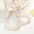 Macro detail of irregular natural rose quartz beads for DIY jewelry making and crafts - Approx 270 Pcs/Strand / Light Pink Texture (0801)