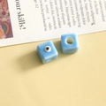 Macro view of light blue cube evil eye glass beads for DIY jewelry and accessory making - Blue Square / 1 Piece
