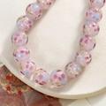 Close-up of pink glass beads with floral patterns on a white textured tray for jewelry - Petal Pattern Style (124#) / 1 Piece / Pink