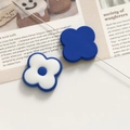 Macro shot of blue and white floral acrylic beads for DIY jewelry making and bracelets - Blue