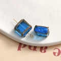Close-up of square blue glass bead with gold leaf edges for DIY jewelry making - 1 Piece / 70# Light Blue