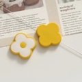Detail of DIY floral acrylic accessories featuring yellow color-block petal components - Yellow