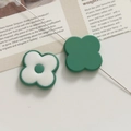 Macro shot of green and white resin floral acrylic charms for DIY jewelry making - Green