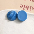Macro view of chic dark blue resin round earring charms with spiral texture - Dark Blue