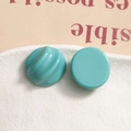 Detail of teal resin semi-circle charms with spiral texture for DIY jewelry making - Lake Green