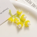 Detailed close-up of handmade floral earrings with yellow beads and white pearls - Yellow