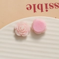 Macro shot of pink resin rose petal charms with flat back design for DIY jewelry - Pink