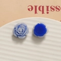 Detailed macro view of sky blue resin rose petals and flat back base for DIY crafts - Blue