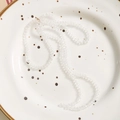 Elegant long transparent beaded crystal chain on a white ceramic plate decoration - 1 Piece / Clear White