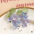 Detail of grape-shaped glass leaf earrings with purple gradient beads and gold wire - Purple