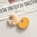 Detailed macro view of cute crescent moon resin charms with orange flocking and yellow finish - Moon
