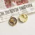 Detailed macro of vintage alloy rose pendant with purple enamel for DIY jewelry making - Chocolate Round Gold Rose