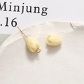 Detailed view of cream tulip resin beads for DIY jewelry making on white stone - Tulip Bud (52#) / 1 Piece / Milky White