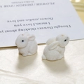 Close-up of cute white flocked rabbit resin charms with soft velvet texture for DIY - White