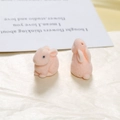 Close-up of pink flocked rabbit DIY resin charms with soft velvet texture for craft making - Light Orange