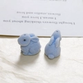 Close-up of a pair of light blue flocked cartoon rabbits for DIY craft and accessories - Blue