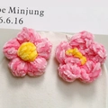 Detailed view of pink chenille puff flower accessories with yellow centers for DIY crafts - Pink