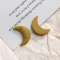 Macro detail of mustard yellow matte resin moon charms with gold star embellishments - Single-Sided Style