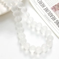 Close-up of frosted semi-transparent white glass beads for DIY jewelry making - 1 Piece / White