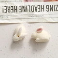 Pair of white flocked 3D bunny resin charms for DIY hair accessories and crafts - Right-facing Rabbit