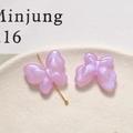 Macro view of butterfly acrylic beads with purple glitter finish for DIY jewelry making - 1 Piece / Purple