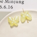 Detail of pale yellow pearlescent acrylic butterfly beads for DIY jewelry making - 1 Piece / Yellow