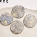 Macro view of four round acetate resin charms with blue marble texture for DIY jewelry - 1 Piece / Blue White Marble