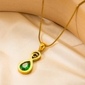 Collar vintage infinito dorado con colgante gota verde esmeralda sobre seda - Letra C