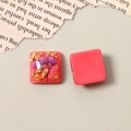 Macro shot of resin squares with dried flowers and gold leaf for DIY jewelry making - Watermelon Red Gold Foil Style