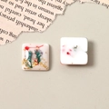 Detail of square resin charms with gold foil, dried flowers and pearls for DIY jewelry - White Pearl Style