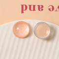 Macro detail of 20mm semi-transparent glitter resin for DIY jewelry and hair accessories - Orange