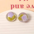 Close-up of translucent resin charms with purple roses for DIY jewelry making - Half Round Style (5030308651424)