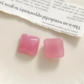 Detailed view of pink translucent resin square charms with a glossy smooth finish - Pink