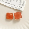 Detail of orange resin square charms with gold glitter for DIY earring and hair clip making - Orange